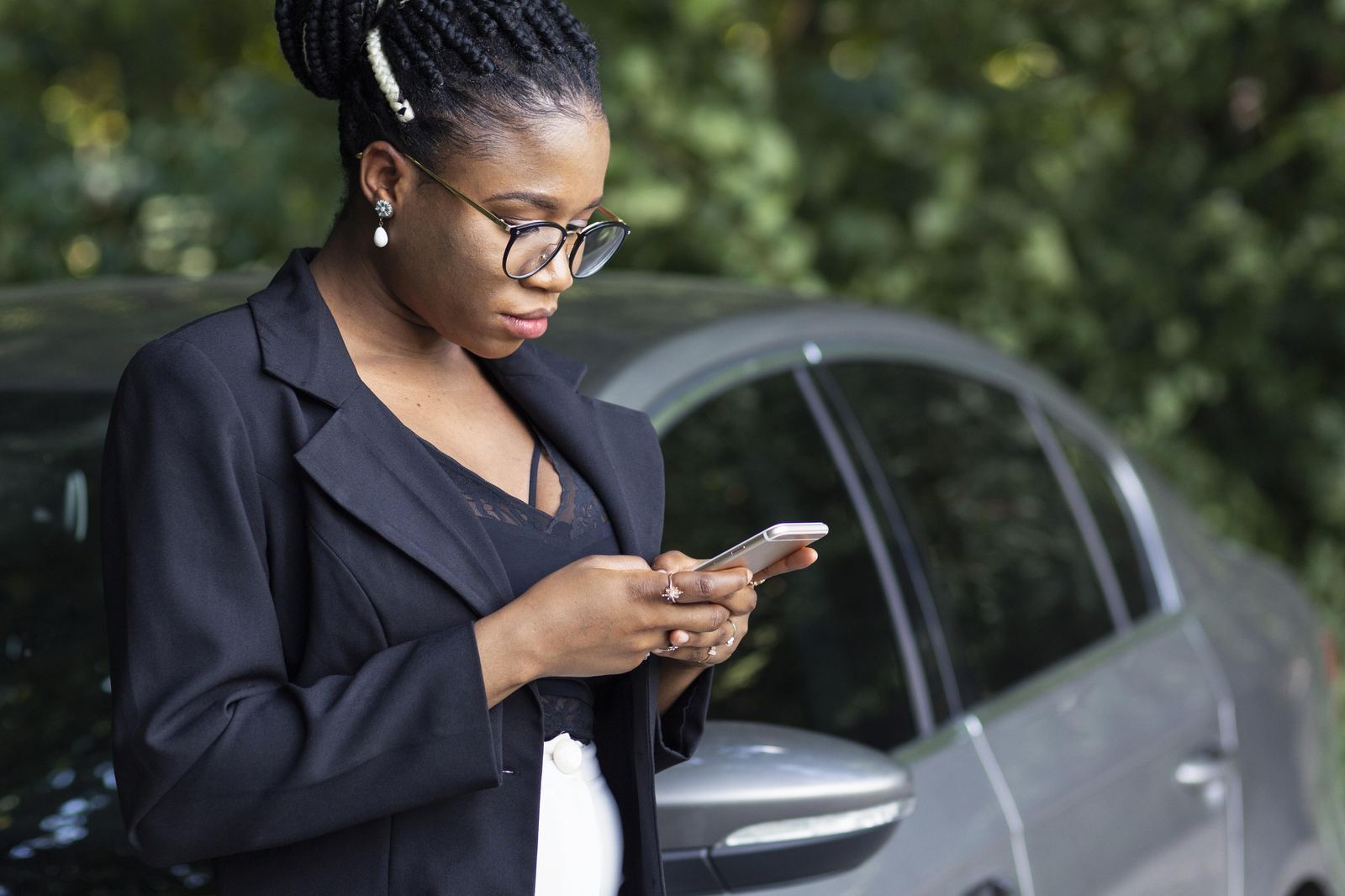 Fleet manager checking vehicle status on a phone