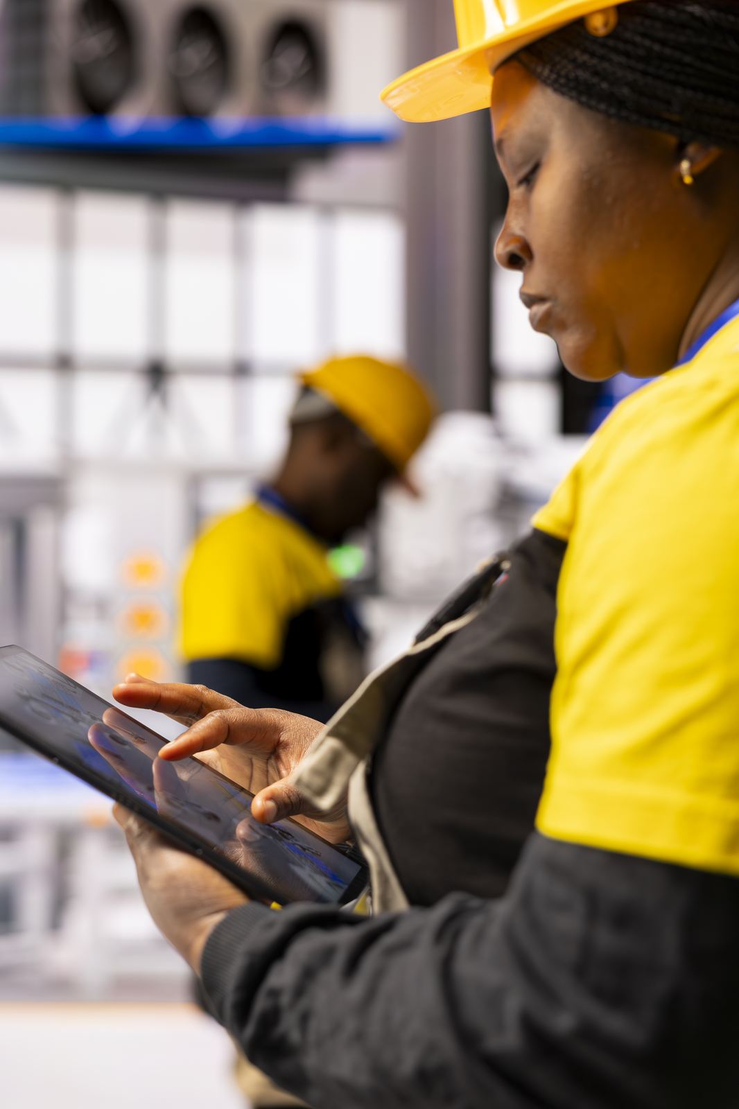 Field technician reviewing fleet data on a tablet