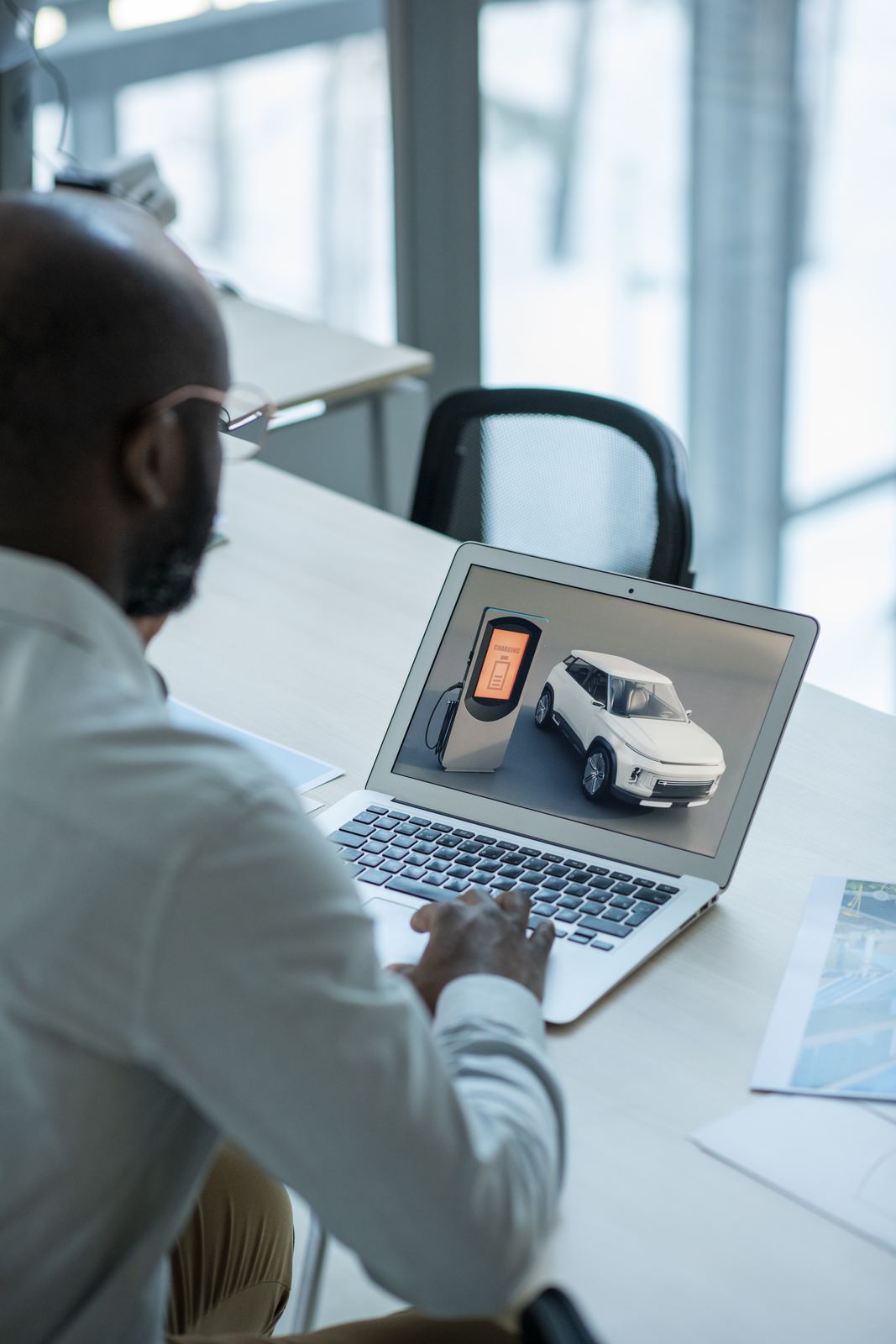 Engineer reviewing a connected vehicle model